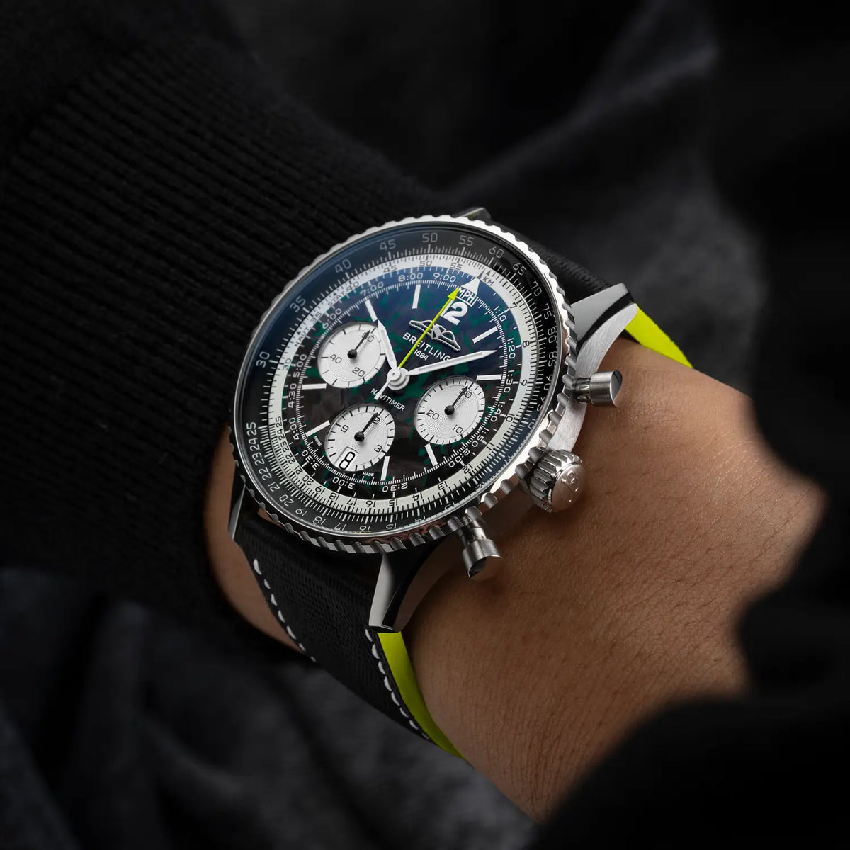 Breitling Navitimer B01 Chronograph 43 Aston Martin Aramco Formula ONE™ team EB01381A1B1X1 – shown on the wrist